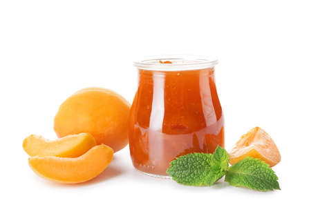 Jar of tasty apricot jam on white backgroundの写真素材