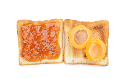Toasts with tasty apricot jam on white backgroundの写真素材