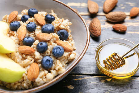 Bowl with tasty sweet oatmeal, closeupの写真素材