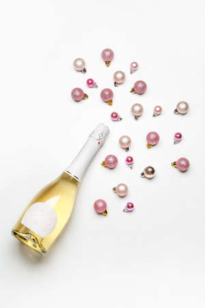 Christmas composition with bottle of champagne on white backgroundの写真素材