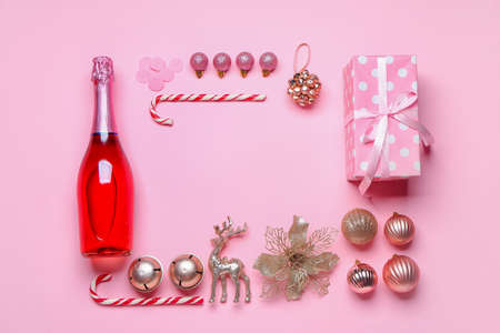 Christmas composition with bottle of champagne on color backgroundの写真素材