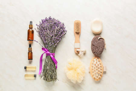 Composition with lavender bouquet and bath products on light backgroundの写真素材
