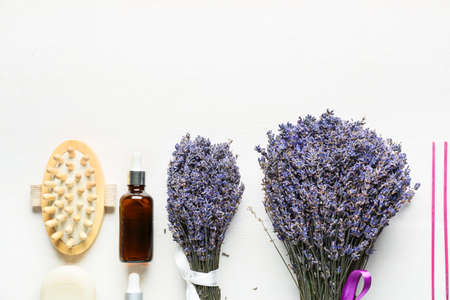 Composition with lavender bouquet and bath products on light backgroundの写真素材