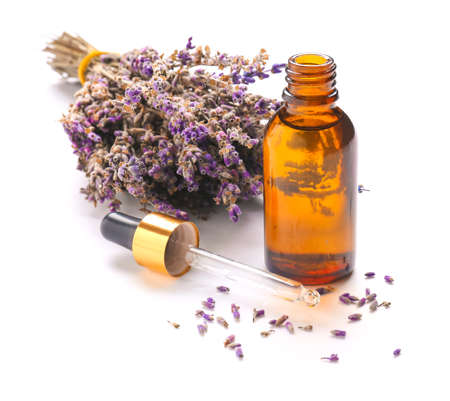 Bottle with lavender essential oil on white backgroundの写真素材