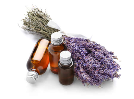 Bottles with lavender essential oil on white backgroundの写真素材