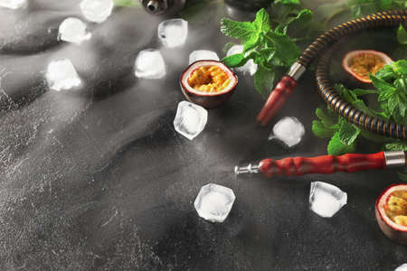 Composition with parts of hookah on dark background
