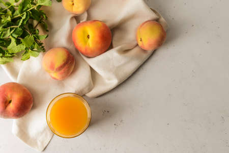 Composition with fresh peach juice on tableの写真素材