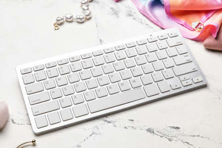 Computer keyboard and accessories on light table