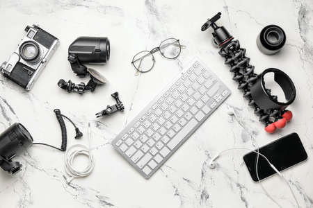 Computer keyboard and modern photographer's equipment on light backgroundの写真素材