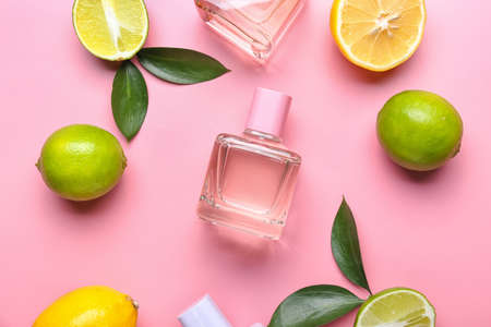 Bottles of citrus perfume on color backgroundの写真素材