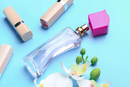 Composition with bottle of perfume on color backgroundの写真素材