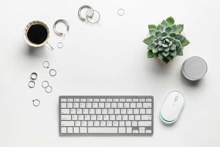 Frame made of keyboard, mouse and accessories on white backgroundの写真素材