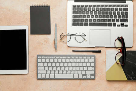 Composition with computer keyboard and different modern devices on color backgroundの写真素材
