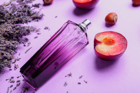 Composition with bottle of perfume and lavender on light backgroundの写真素材