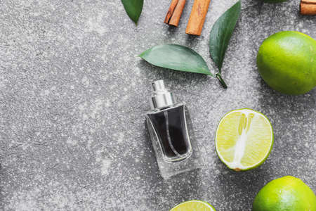 Bottle of perfume on dark background