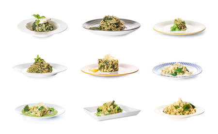 Plates with tasty pasta and vegetables on white backgroundの写真素材