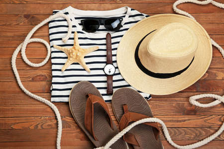 Male beach accessories on wooden backgroundの写真素材