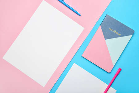 Composition with blank paper sheets and stationary on color backgroundの写真素材