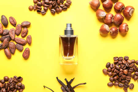 Composition with bottle of perfume on color backgroundの写真素材