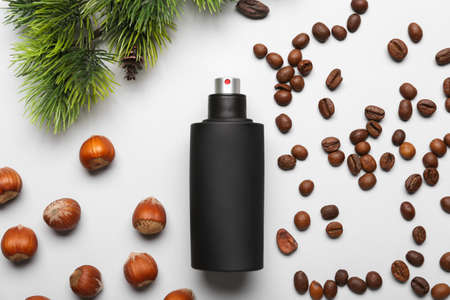 Composition with bottle of perfume on light background