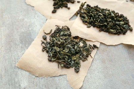 Dry tea leaves on gray backgroundの写真素材
