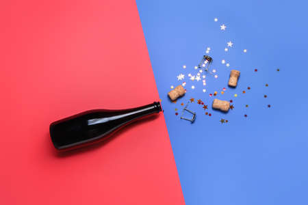 Festive composition with champagne on color background