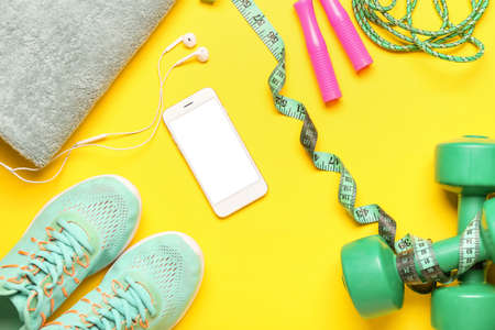 Set of sport equipment on color backgroundの写真素材