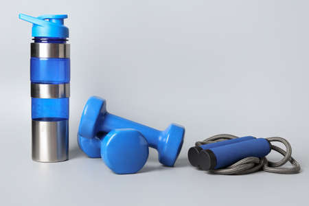 Set of sport equipment on light backgroundの写真素材