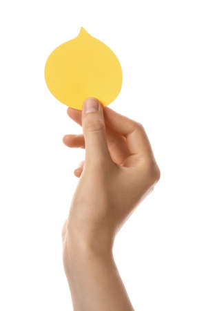 Female hand with blank note paper on white backgroundの写真素材