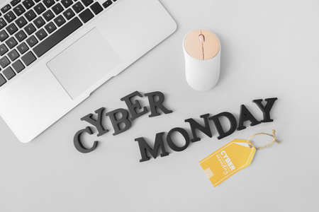 Laptop with text CYBER MONDAY on gray backgroundの写真素材