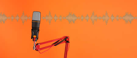 Stand with microphone on color background
