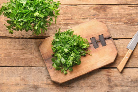 Composition with fresh parsley on tableの写真素材