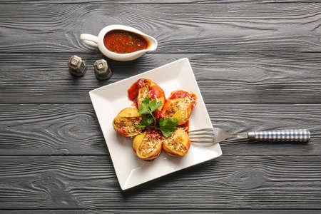 Plate with tasty conchiglioni pasta on tableの写真素材