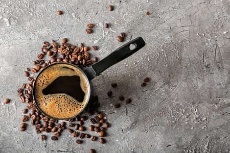 Pot with hot coffee on gray backgroundの写真素材