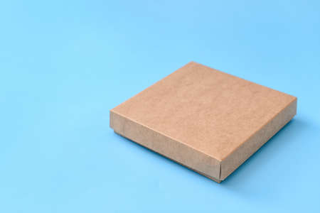 Blank cardboard box on color backgroundの写真素材