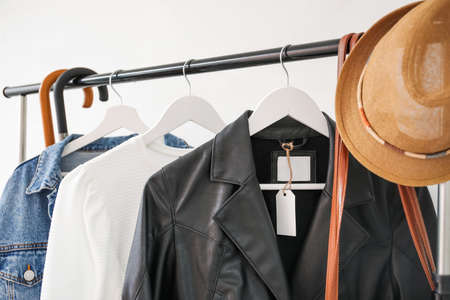 Clothes on hangers with blank paper label