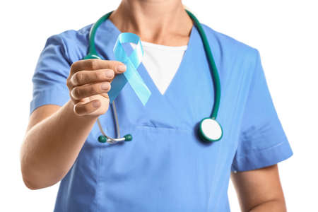 Doctor with blue ribbon on white background. Diabetes awareness conceptの写真素材