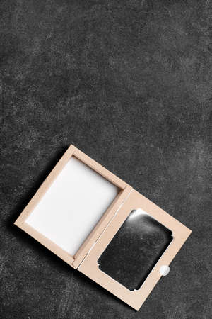 Blank cardboard box on dark backgroundの写真素材