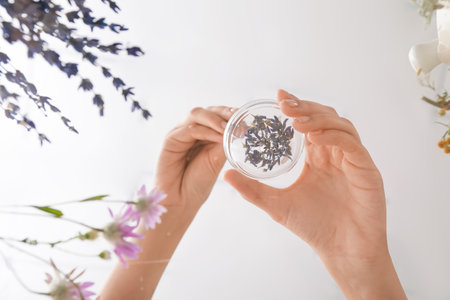 Woman making herbal based medicines on tableの写真素材