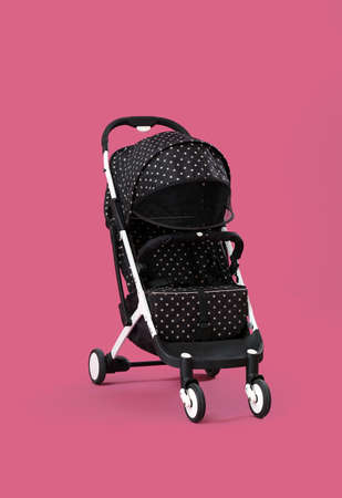 Modern baby stroller on color background