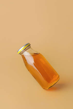 Bottle of juice on color background