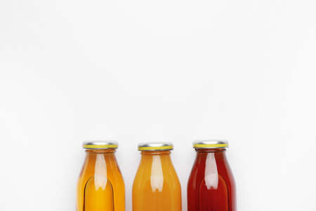 Bottles of juices on white backgroundの写真素材