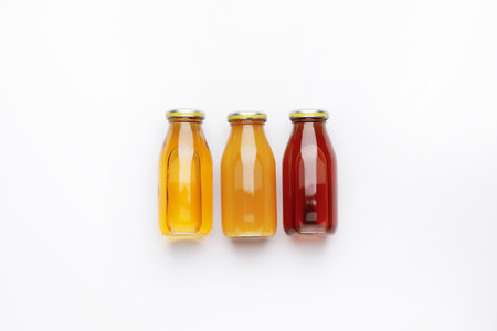 Bottles of juices on white backgroundの写真素材