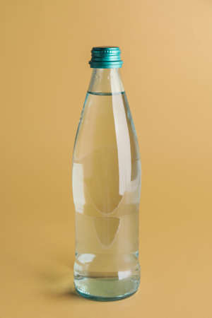 Bottle of clean water on color background