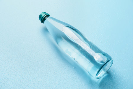 Bottle of clean water on color background