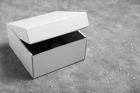 Blank cardboard box on gray background