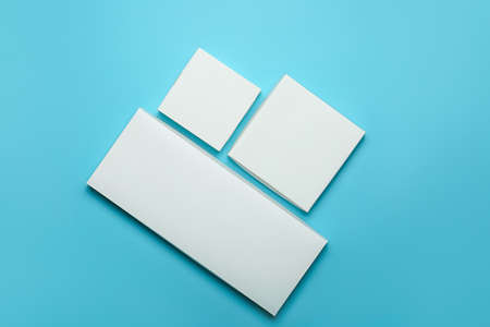 Blank cardboard boxes on color background