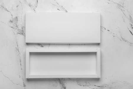 Blank cardboard box on light background