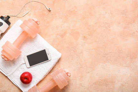 Sports equipment on color background