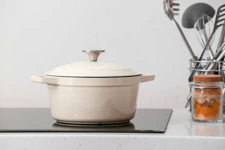Cooking pot on electric stove in kitchenの写真素材
